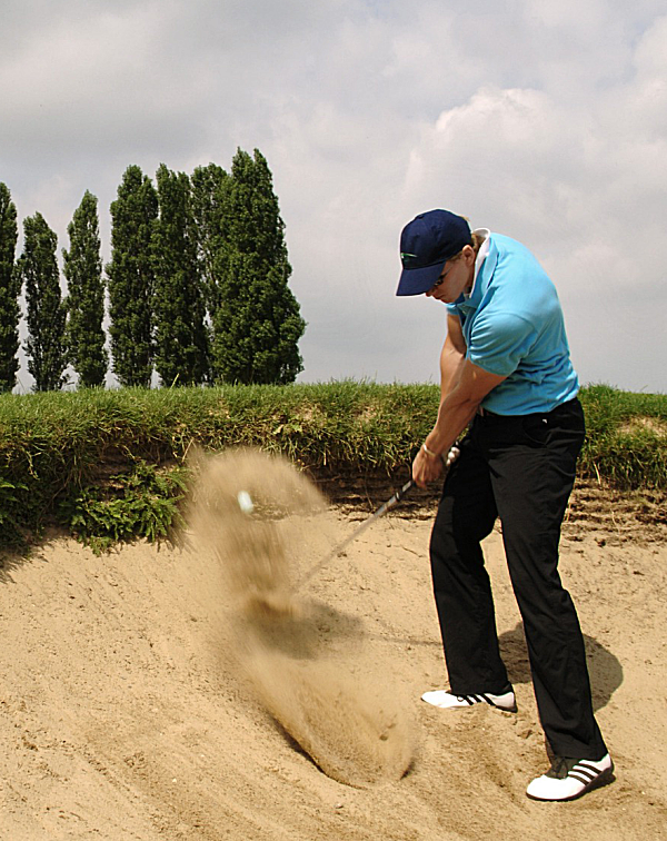 Golfer in a sand bunker